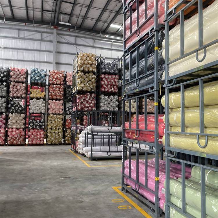 Organized handbag material warehouse with leather fabric rolls and quality control management