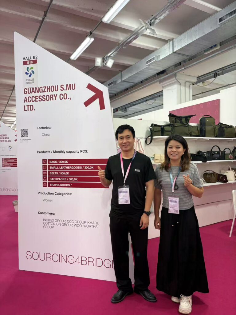 Guangzhou S.MU Accessory Co Ltd exhibition board showing bag manufacturing categories and sourcing information at Expo Riva Schuh and Gardabags.