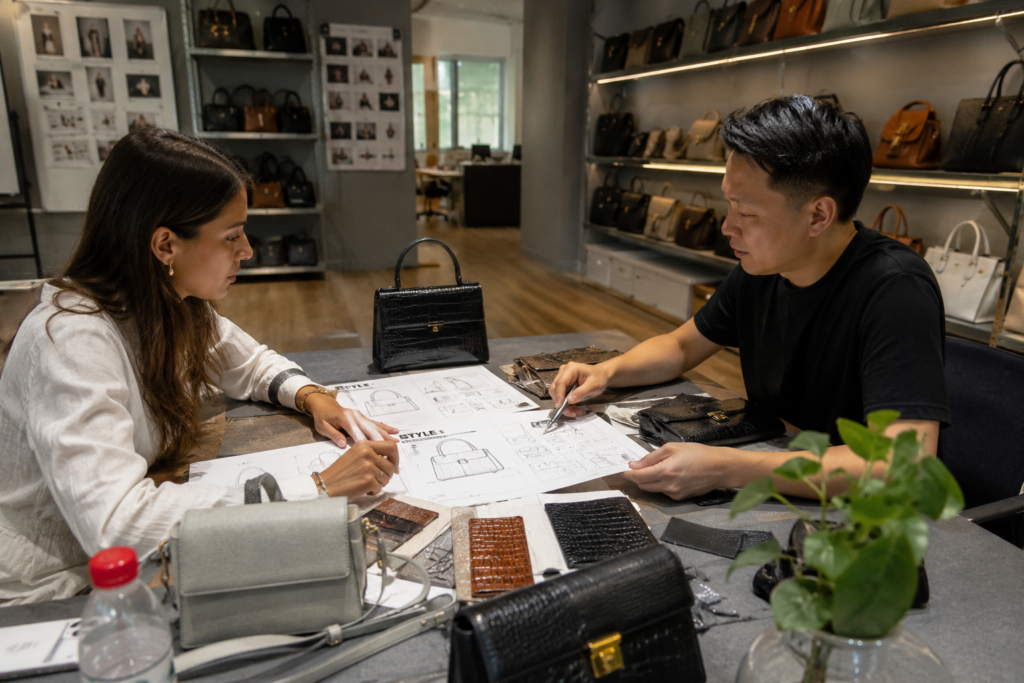 International buyer comparing OEM bag technical pack and ODM handbag samples